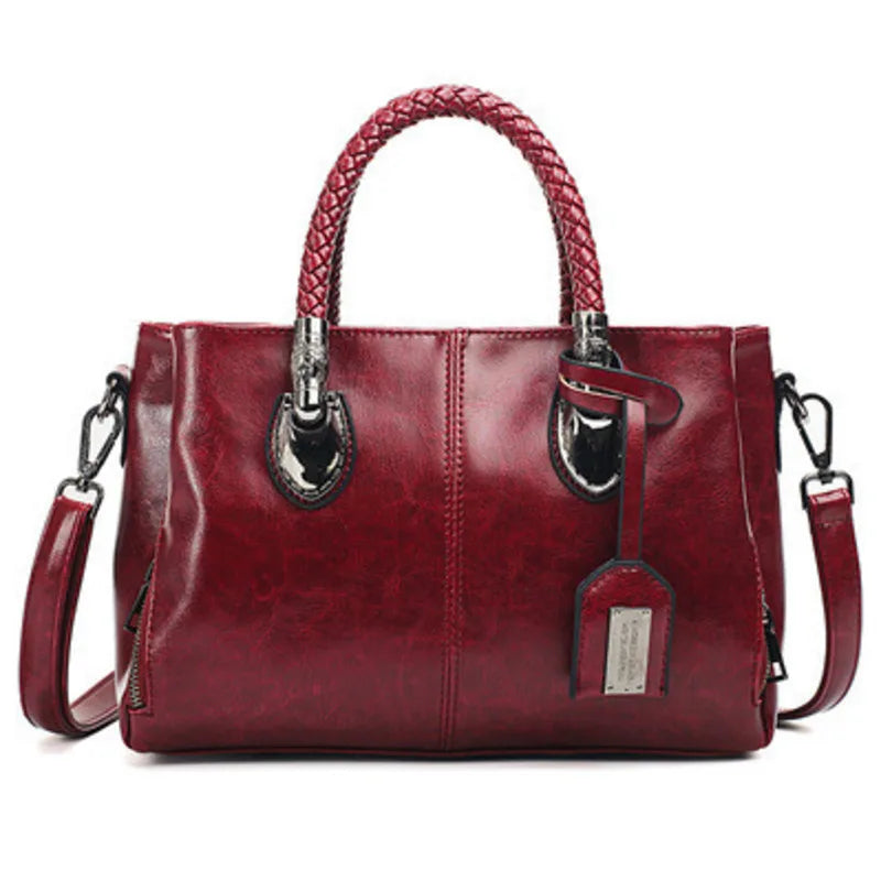 Giana | Elegante Lederhandtasche mit geflochtenem Griff