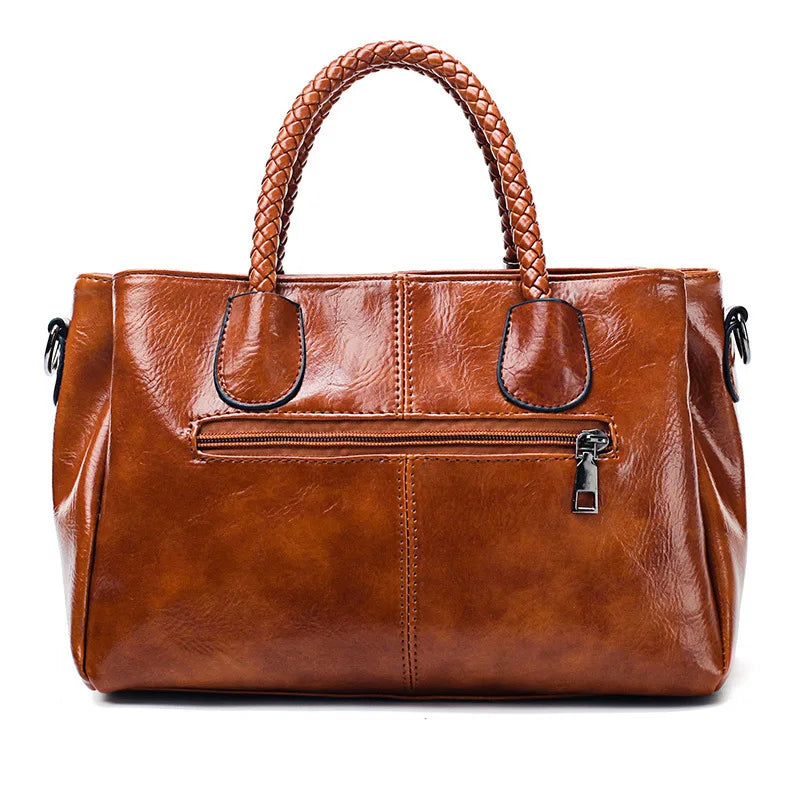 Giana | Elegante Lederhandtasche mit geflochtenem Griff