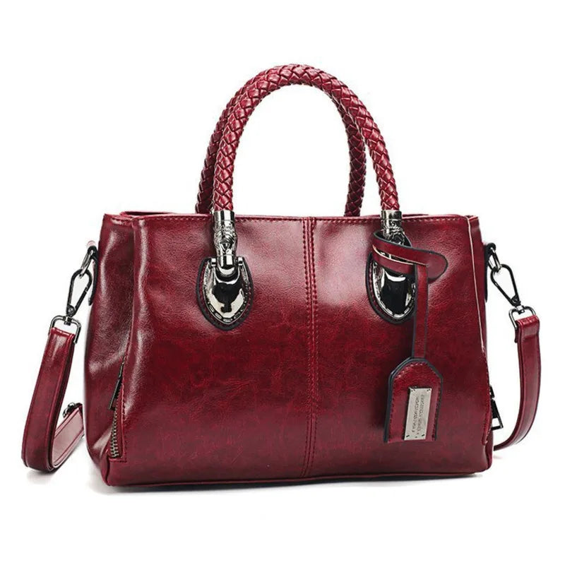 Giana | Elegante Lederhandtasche mit geflochtenem Griff